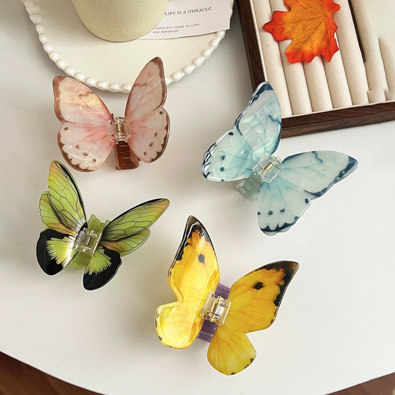 Hi Tech Accessories - Pince à cheveux papillon 3D colorée